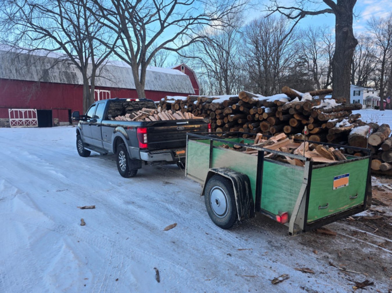 Liberty Firewood truck and trailer loaded with split Michigan firewood for delivery