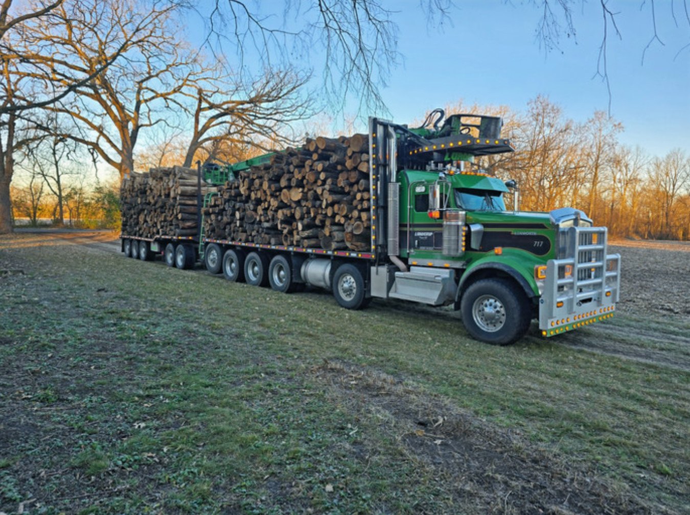 Semi truck delivering a bulk load of Michigan hardwood logs to Liberty Firewood